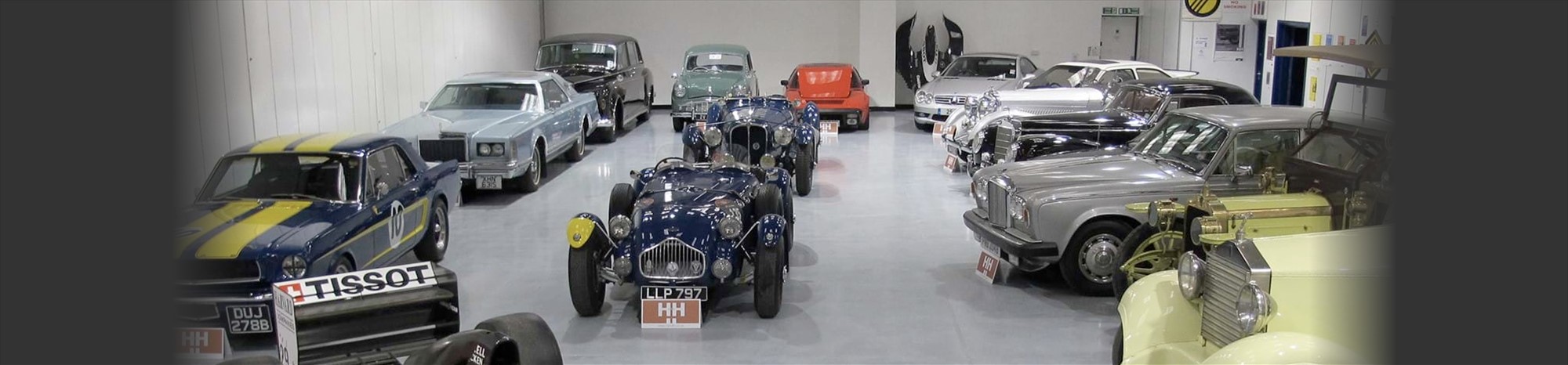 H&H Classic Car Auction showroom featuring Rolls Royce and Mercedes