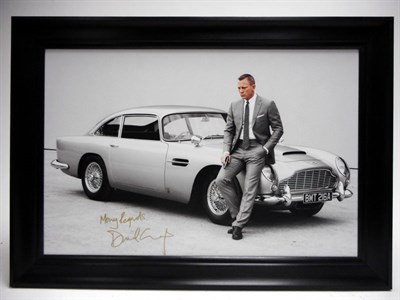 Lot 211 - Daniel Craig as James Bond and the Aston Martin DB5 (Signed)