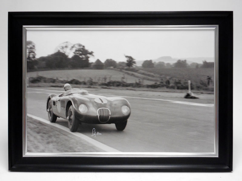 Lot 148 - Stirling Moss in the Jaguar C-type (Signed)