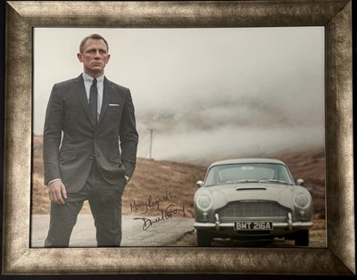 Lot 104 - Daniel Craig / James Bond and the Aston Martin DB5 Signed Exhibition Board