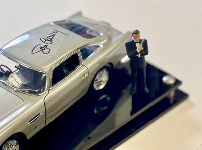 Lot 135 - Sean Connery Signed 1:18 Aston Martin DB5 Model and Figurine Presentation