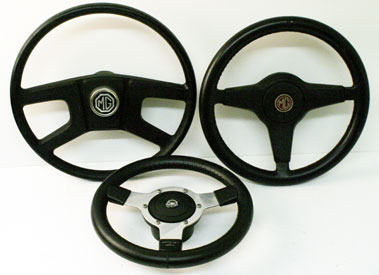 Lot 818 - Two Mg Steering Wheels & One Other