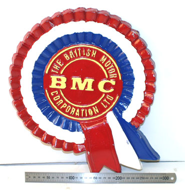 Lot 808 - Bmc Rosette Cast Metal Wall Plaque