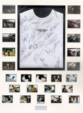 Lot 612 - Large Signed Suzuka F1 T-Shirt Presentation