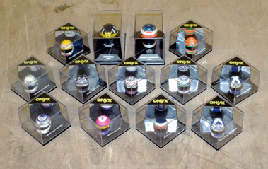Lot 204 - 25 Miniature F1 Helmet Models